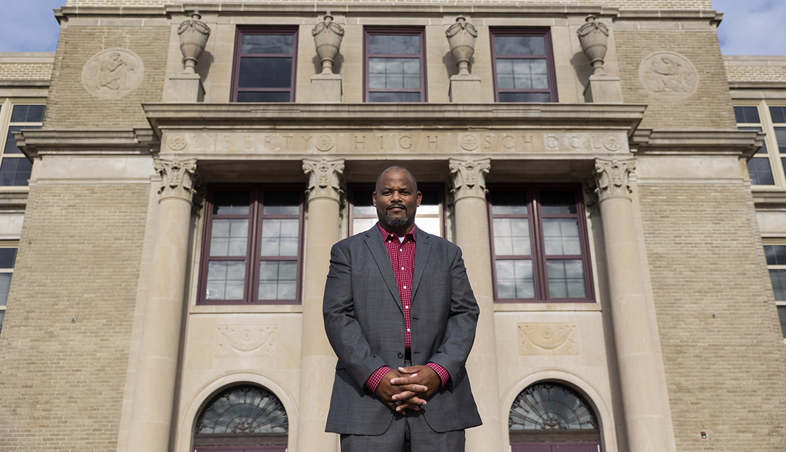 Dr. Harrison Bailey III, Principal of Liberty High School, poses for a photo in front of the school in Bethlehem, Pennsylvania on August 10, 2022. (Photo by Rachel Wisniewski for AARP) 